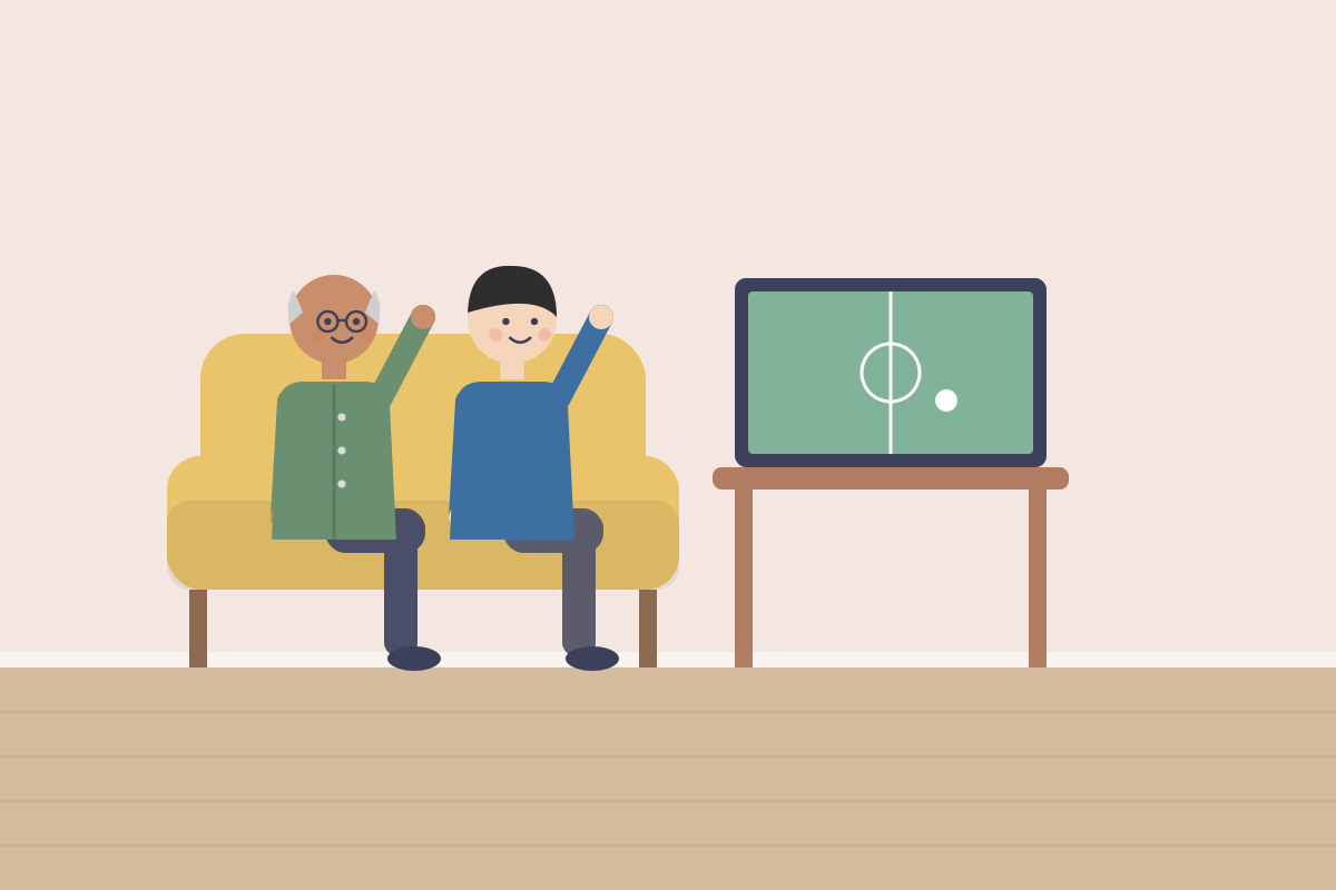 Senior i syn kibicują przed telewizorem
